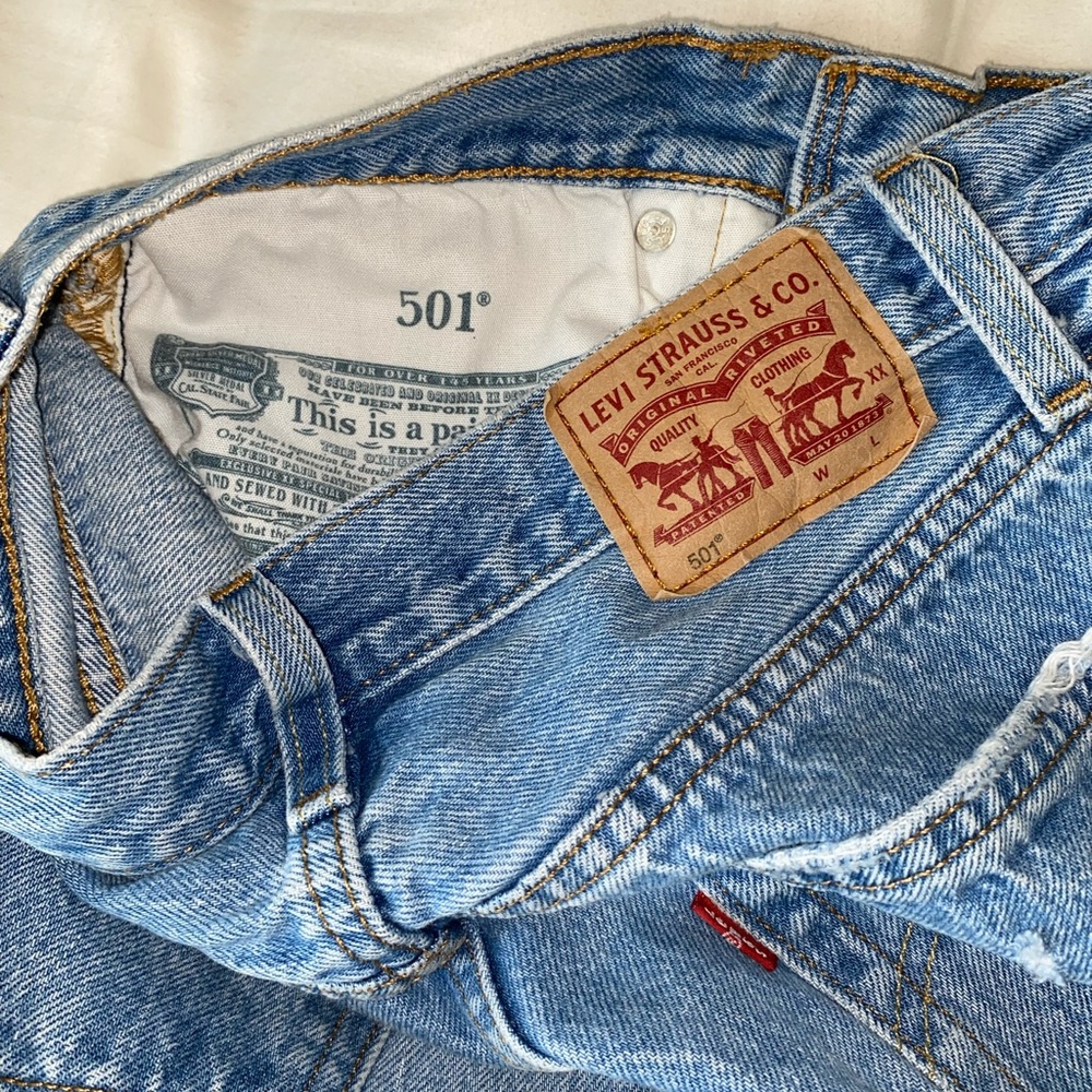 Levi 501 jeans they fit like mom jeans the rips are super cute